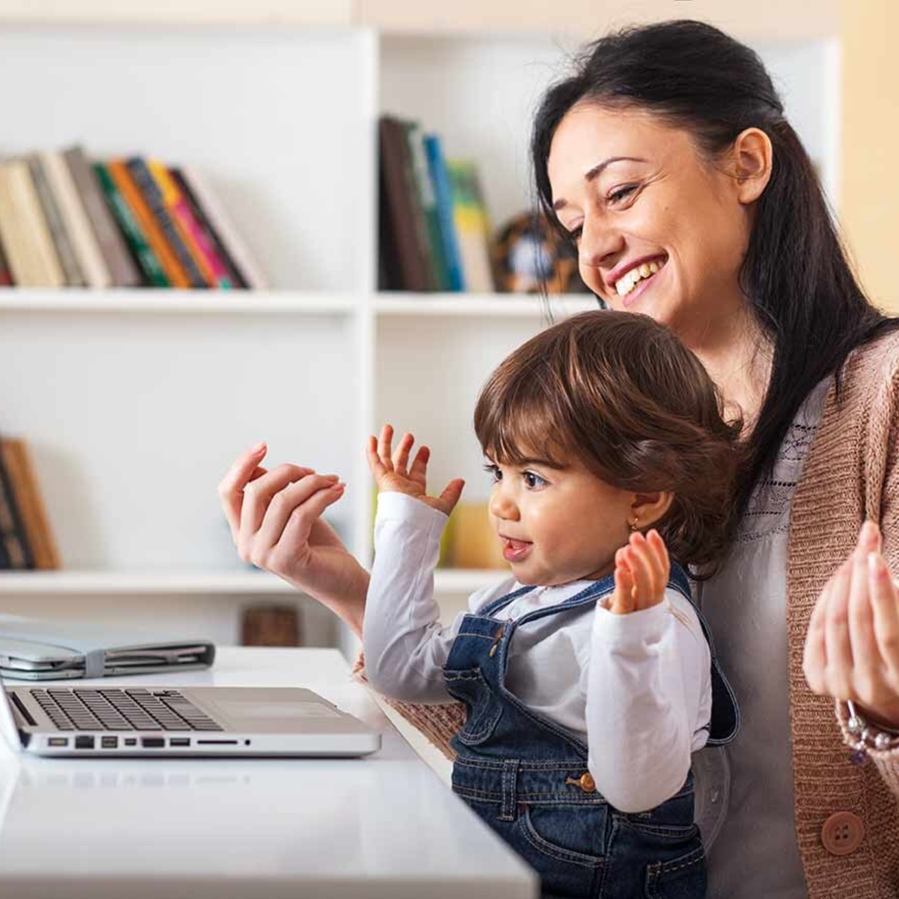 Mother and child sitting at computer 